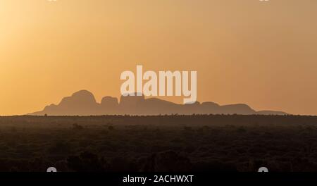 Olgas, also known as Kata Tjutu, in silhouette at sunset Stock Photo