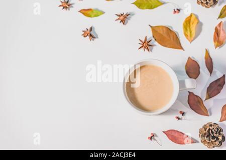 Autumn or Winter composition with dried autumn leaves, coffee cup pine and and anise stars. Flat lay, top view. Stock Photo