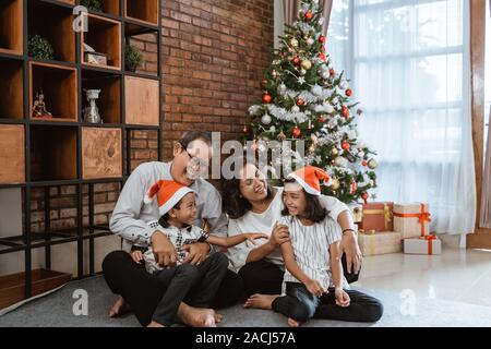 grandparents and child playing together on christmas day Stock Photo
