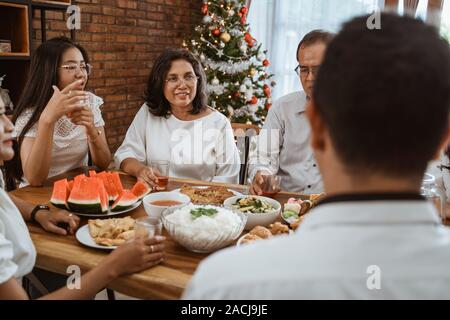 asian family tradition having lunch together on christmas day Stock Photo