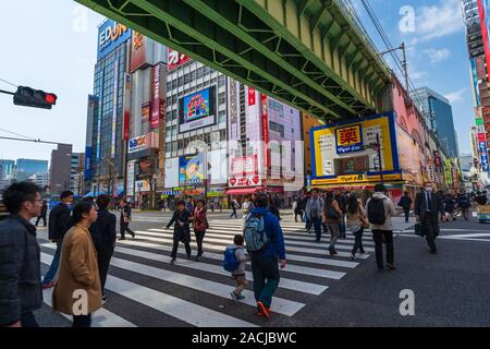 Akihabara, JAPAN - March 25, 2019: unidendified people walk across the street in Akihabara at Tokyo, Japan Stock Photo