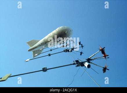 Weather balloon and instruments. This is a captive (tethered) weather balloon. It remains anchored to the ground rather than being released to obtain Stock Photo