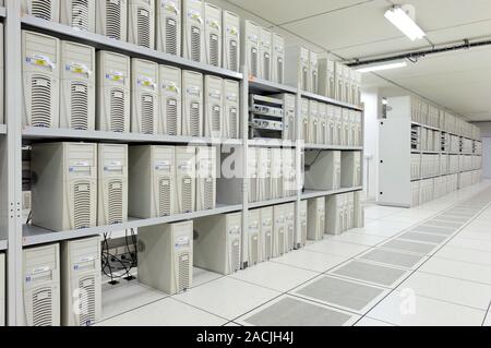 Central data processing room. Shelves of computers in the central server room of the European Organization for Nuclear Research, or CERN. CERN is an i Stock Photo