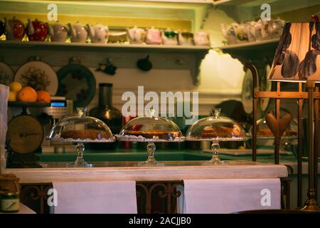 Interior design of a counter in a cozy cafe. Old dishes and furniture create an atmosphere of comfort in a small family business Stock Photo