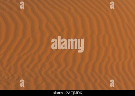 Close up of the wide ripples of the sand dunes in the beautiful sunshine in the United Arab Emirates. Stock Photo