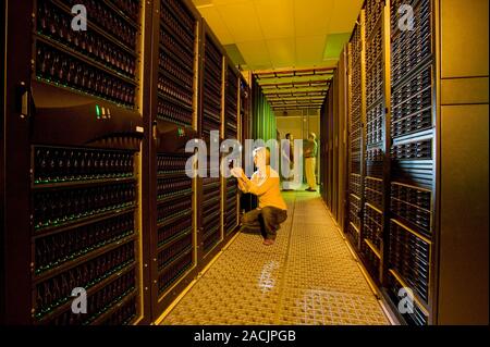 Hyperion supercomputer. Researchers working on units of the Hyperion supercomputer. This is a next-generation supercomputer based on Linux clusters, b Stock Photo