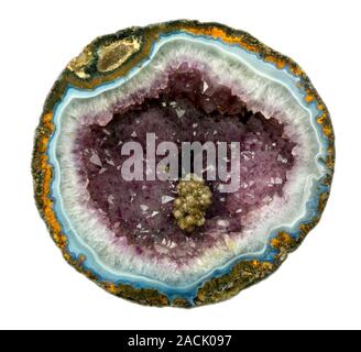 An amethyst geode is formed when large crystals grow in open spaces inside the rock. Stock Photo