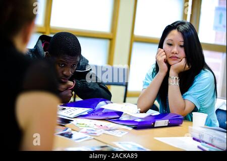 Teenagers looking bored in a classroom. Stock Photo