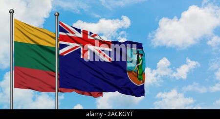 Lithuania and Montserrat flag waving in the wind against white cloudy blue sky together. Diplomacy concept, international relations. Stock Photo