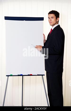 Businessman with flipchart Stock Photo