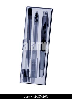 Writing case, X-ray. The three writing implements in this case are, from left to right: a rubber-tipped graphite pencil, a spring-loaded ballpoint pen Stock Photo