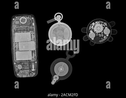 Assorted common objects. X-ray of common objects, including a mobile phone (left), a pocket watch (upper centre), a combined map wheel and compass (lo Stock Photo