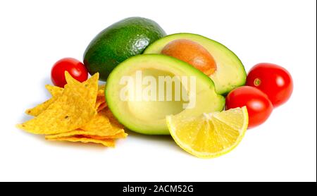 Avocado with tomatoes and lemon. Ingredients for Guacamole. Isolated Stock Photo