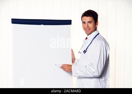 Successful doctor with flipchart Stock Photo