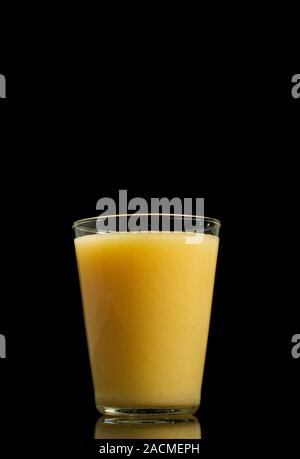 Glass of healthy fresh cold melon smoothies isolated on black background with copy space Stock Photo