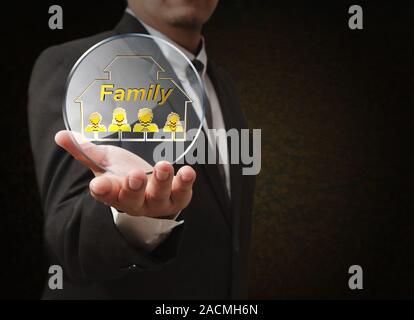 hand shows 3d family pixel icon as concept Stock Photo