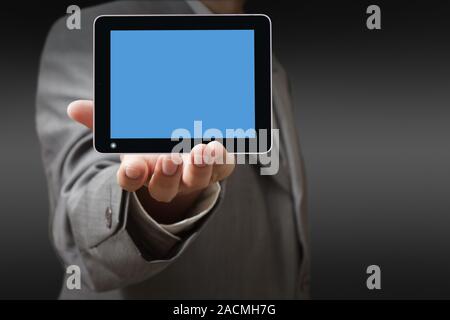 Businessman using his digital tablet Stock Photo