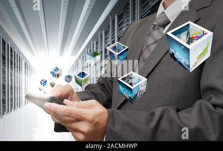 Business man hand touch tablet computer streaming images in server room Stock Photo