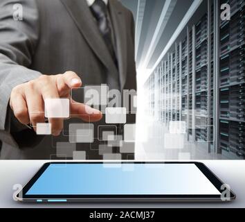 Business man and tablet computer in server room Stock Photo