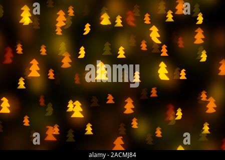 christmas tree shaped yellow bokeh of lights Stock Photo