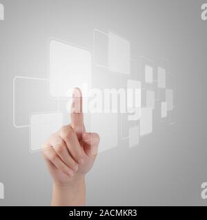 hand pushing a button on a touch screen Stock Photo