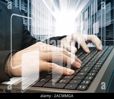 male hands typing on a laptop Stock Photo