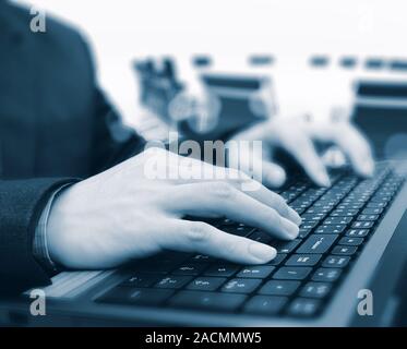 Close-up of typing male hands Stock Photo