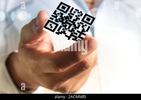 Business hand shows 3d Qr code Stock Photo