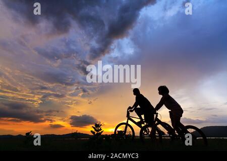 Beautiful Couple on bicycles Stock Photo