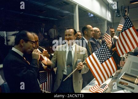Apollo 11 officials celebrating. NASA and Manned Spacecraft Center (MSC) officials and controllers celebrating the safe return of the Apollo 11 missio Stock Photo