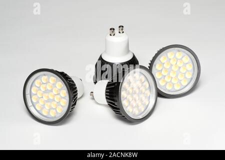 LED light bulbs. LEDs (light-emitting diodes) use about one tenth of the energy for a given light output when compared with normal incandescent bulbs, Stock Photo