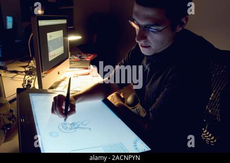 Graphic designer. Graphic design student working on a 3D female character. Stock Photo