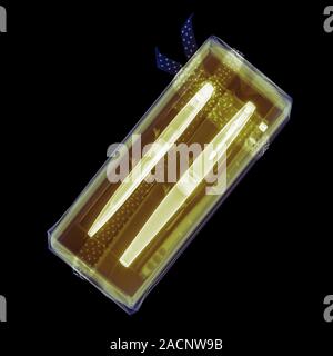 Coloured x-ray of pens in a gift box. This image was produced by Hugh Turvey, Artist in Residence, British Institute of Radiology. Stock Photo