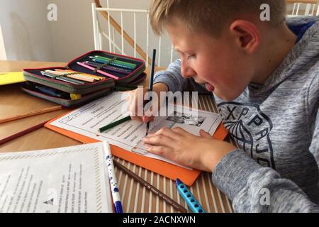 Munich, Deutschland. 03rd Dec, 2019. PISA study Germanys students again worse. Archive photo: A boy, 4th grade student doing his homework at home, learning. | usage worldwide Credit: dpa/Alamy Live News Stock Photo