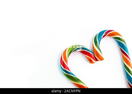 Colorful festive Lollipop in shape of heart on white background selective focus. Stock Photo