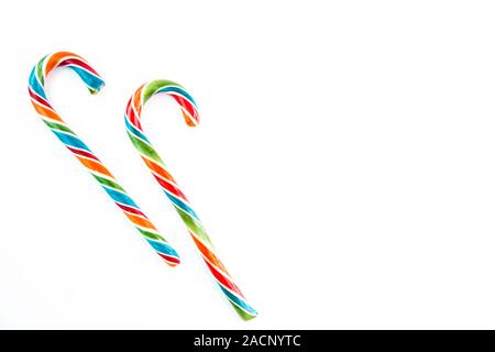 Two colorful festive Lollipop on white background selective focus top of view. Stock Photo