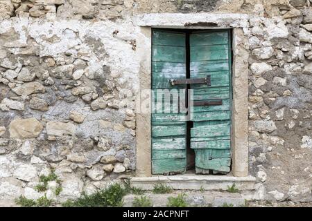 Entrance door of an abandoned house, Greece Stock Photo