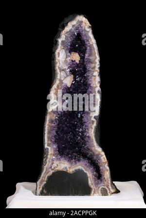 Amethyst geode interior. Amethyst is a purple variety of quartz or silica oxide (SiO2) that is itself usually white or clear. The colouring of amethys Stock Photo