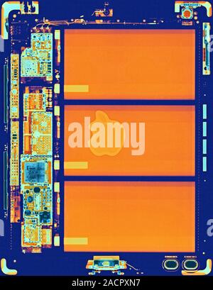 Coloured x-ray of an iPad tablet computer showing the internal structure. The design of the tablet, the name 'iPad' and the Apple logo are registered Stock Photo