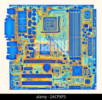 Computer motherboard, coloured x-ray of the main circuit board (motherboard) of a personal computer (PC). Motherboard components include transistors, Stock Photo