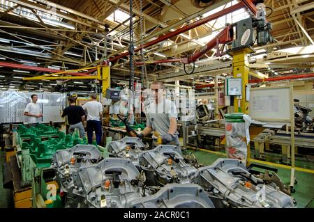 Car spare parts factory. Workers in the Renault spare parts factory, Grand-Couronne, France. Stock Photo