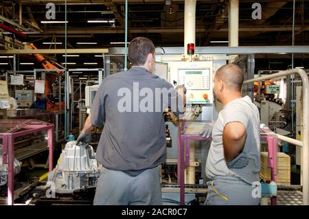 Car spare parts factory. Workers in the Renault spare parts factory, Grand-Couronne, France. Stock Photo