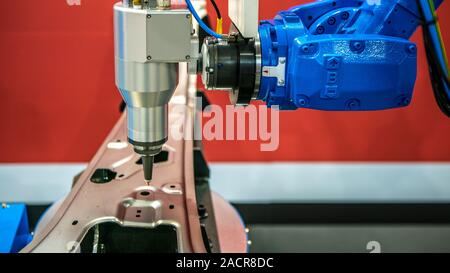 Robotic arms works on factory on manufacture of cars. Industrial robotic welders weld the car body. Machine robot arm. Smart industry. Automobile prod Stock Photo
