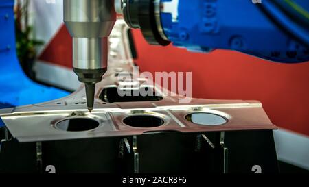 Robotic arms works on factory on manufacture of cars. Industrial robotic welders weld the car body. Machine robot arm. Smart industry. Automobile prod Stock Photo