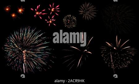Colorful variety fireworks isolated on black background. Beautiful firework light on dark background. Celebration and anniversary concept. Stock Photo
