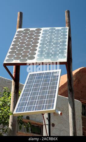 Domestic solar panels. Photovoltaic cells on poles, used to provide power to a house. Photographed in McGregor, Western Cape, South Africa. Stock Photo