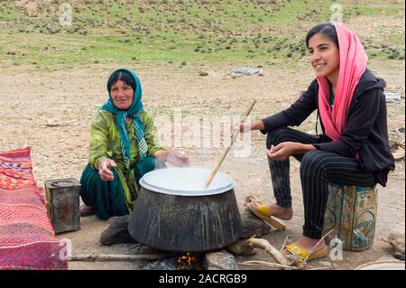 Qashqai woman boiling milk at camp, nomad people, Iran Stock Photo - Alamy