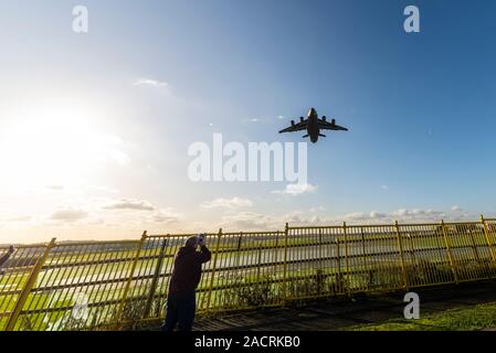 United States Air Force Boeing C-17 Globemaster jet transport plane taking off RAF Northolt, London, UK after delivering Marine One for NATO summit Stock Photo