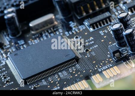 Integrated semiconductor microprocessor on a circuit board. Photo of electric component in electronic device Stock Photo