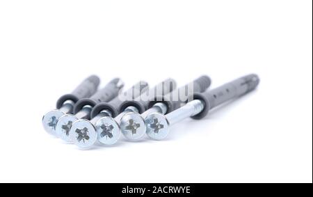 Screws and dowels isolated on white background Stock Photo